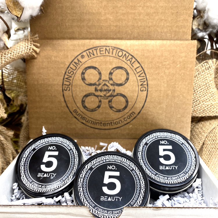 a box with black round containers with white text and numbers on it