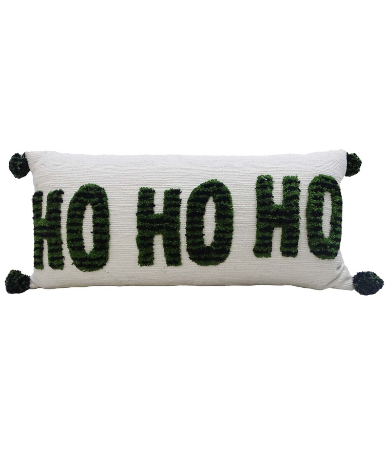 a white and green pillow with black letters
