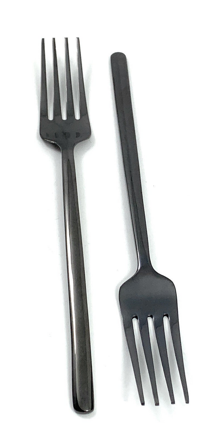 a pair of forks on a white background