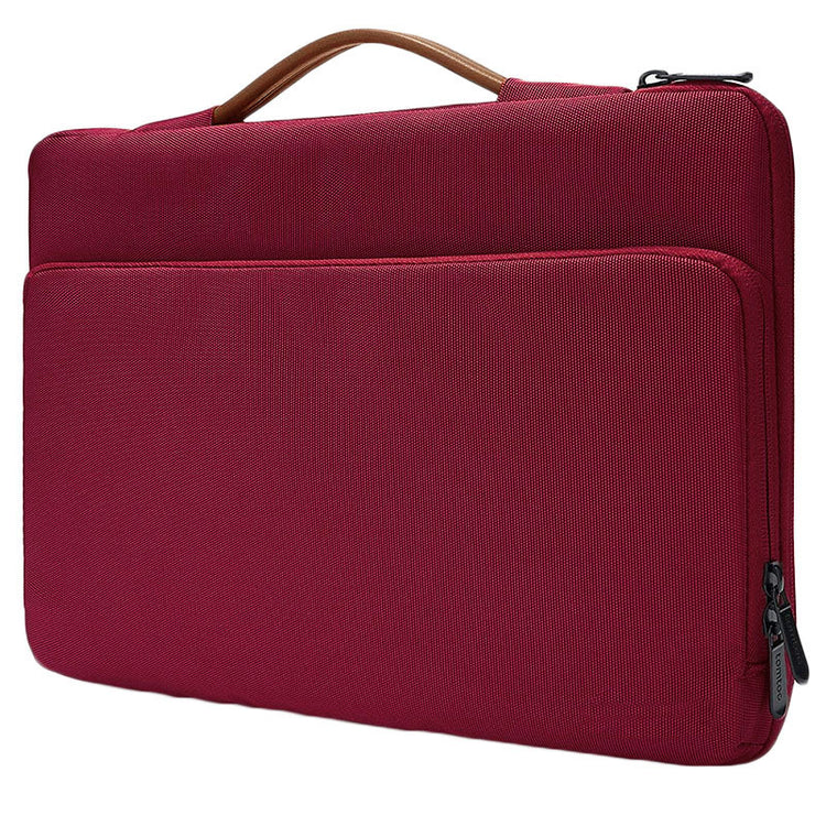 a red bag with a brown handle