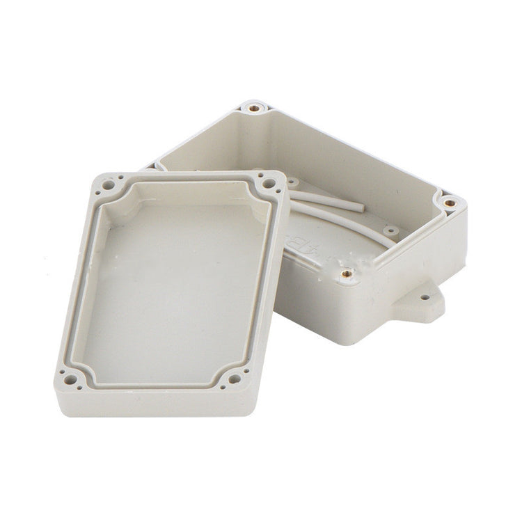 a white plastic box with a wire