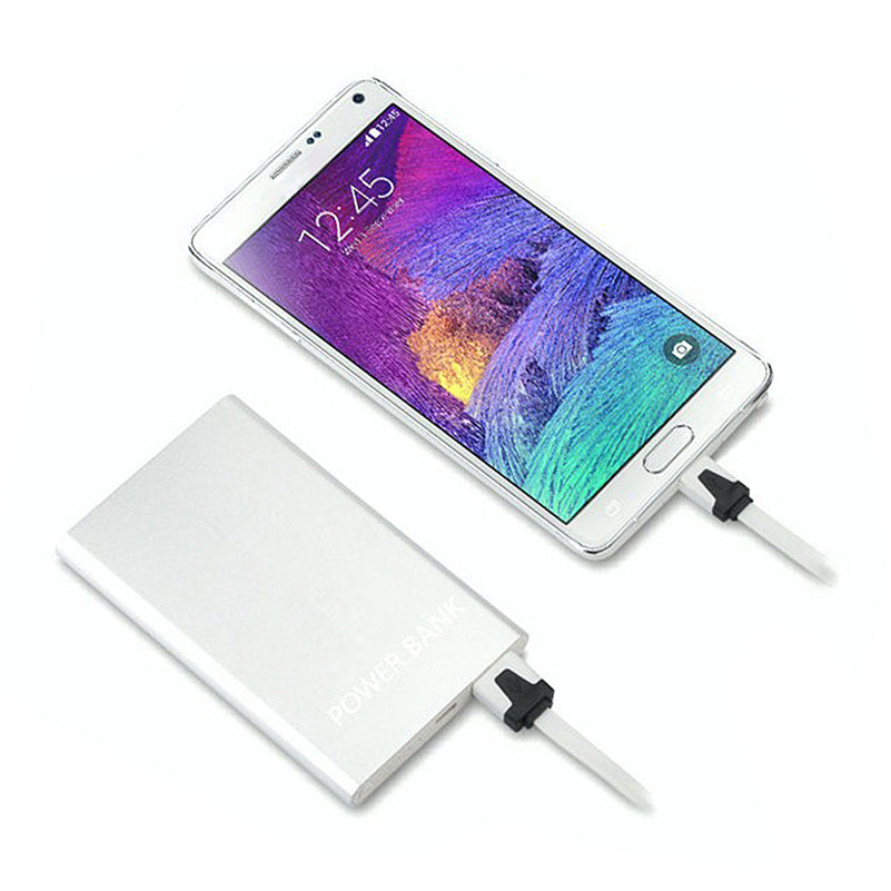 a cell phone charging with a power bank