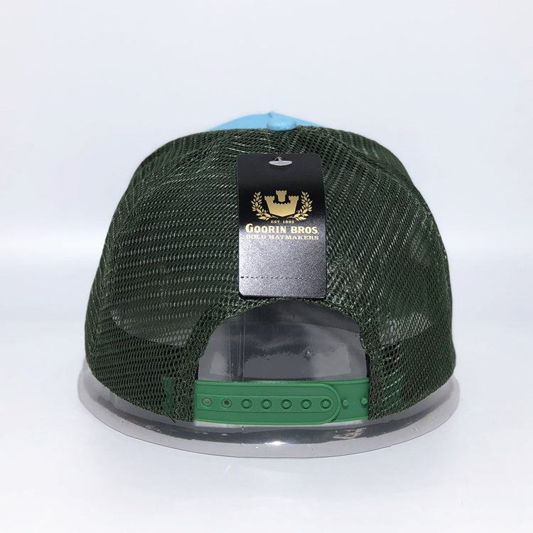 a green and blue hat with a black label