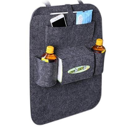 a grey bag with bottles and a phone