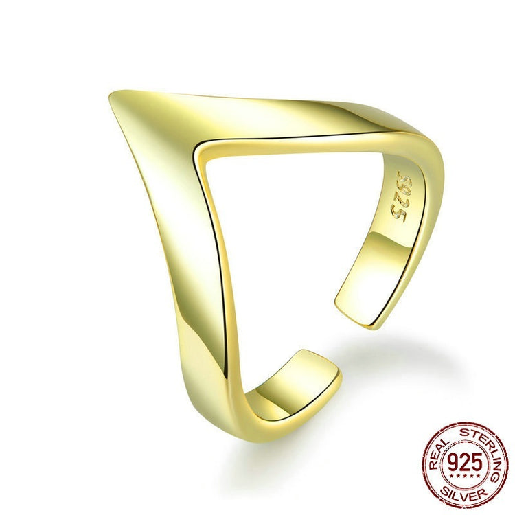 a gold ring on a white background