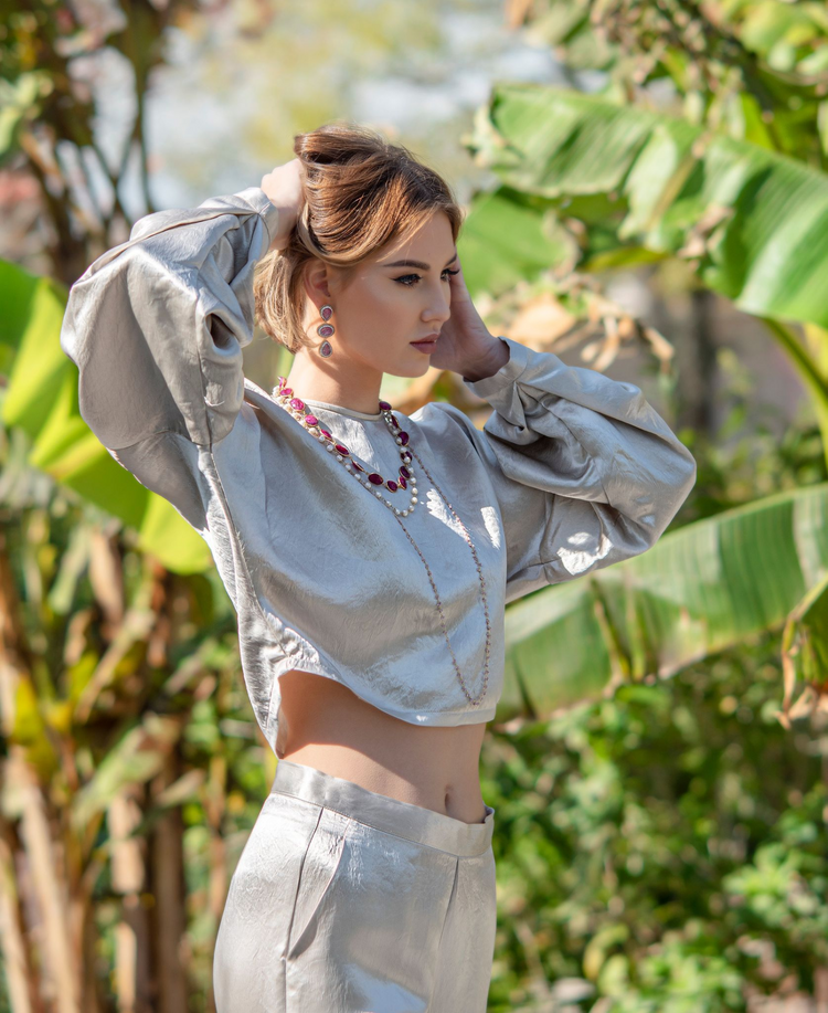 a woman in a silver outfit