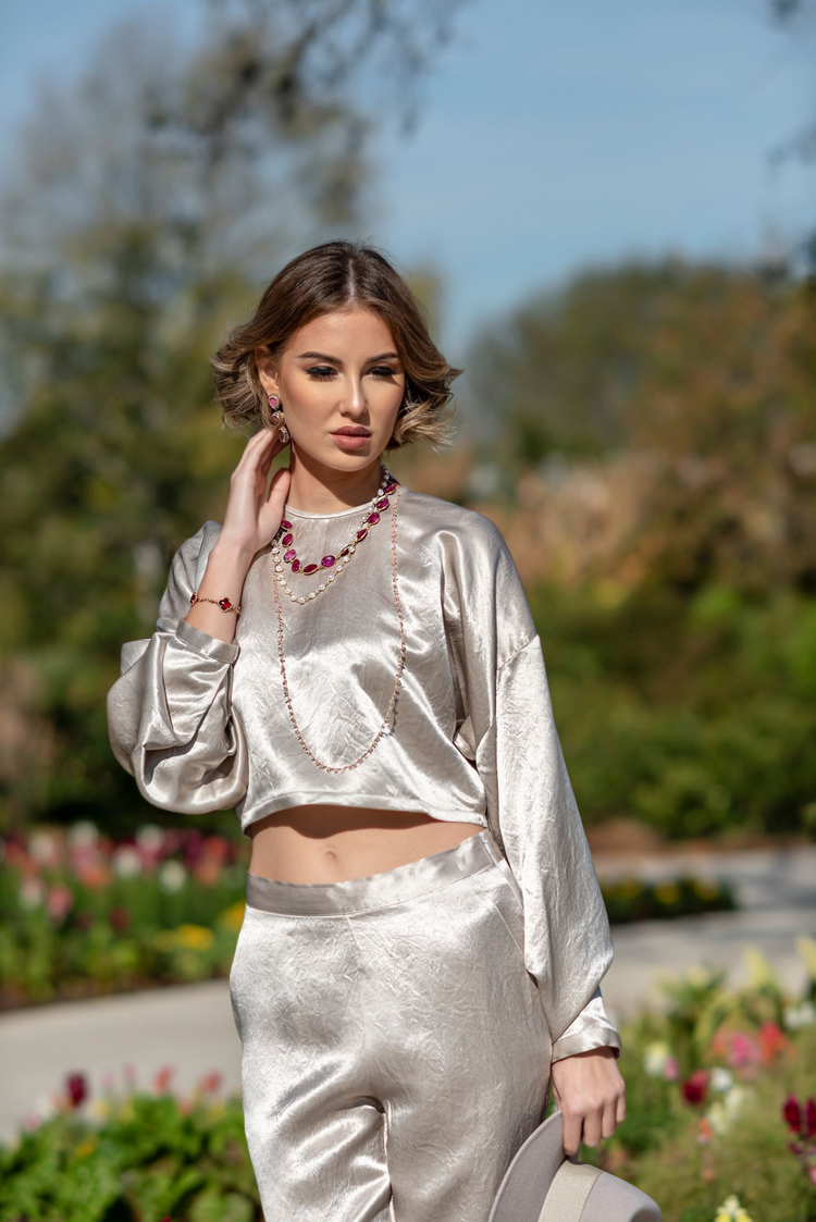 a woman wearing a silver outfit
