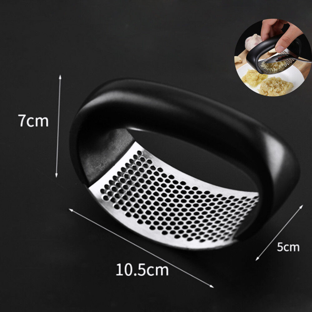 a circular metal object with a black handle