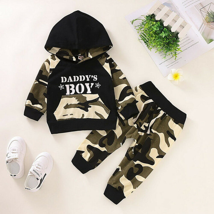 a camouflage hoodie and pants