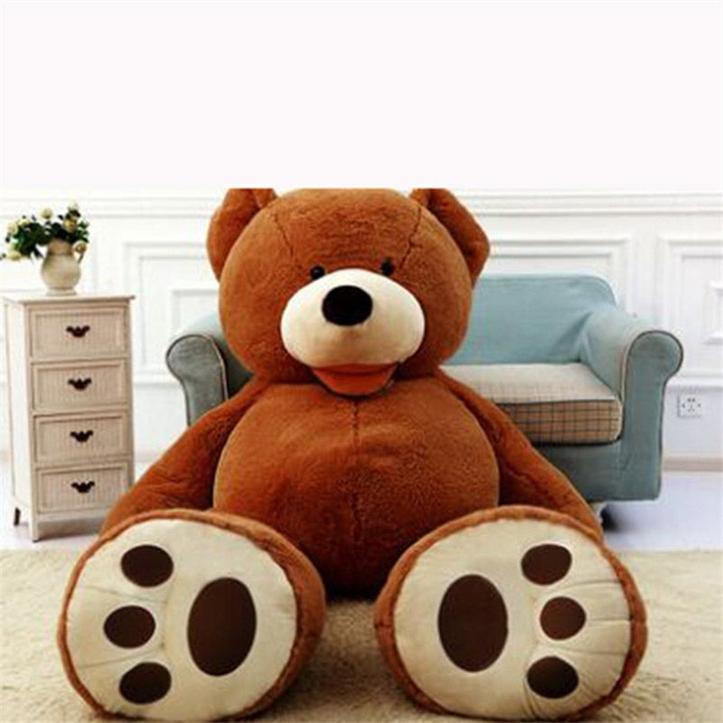 a large teddy bear sitting on a carpet