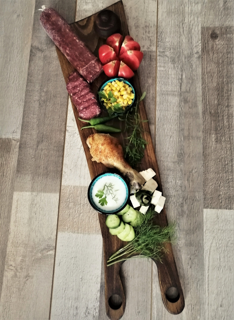 a wooden board with food on it