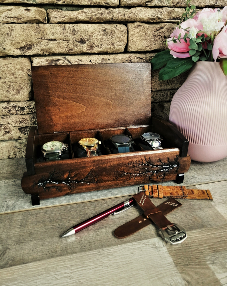 a wooden box with watches in it