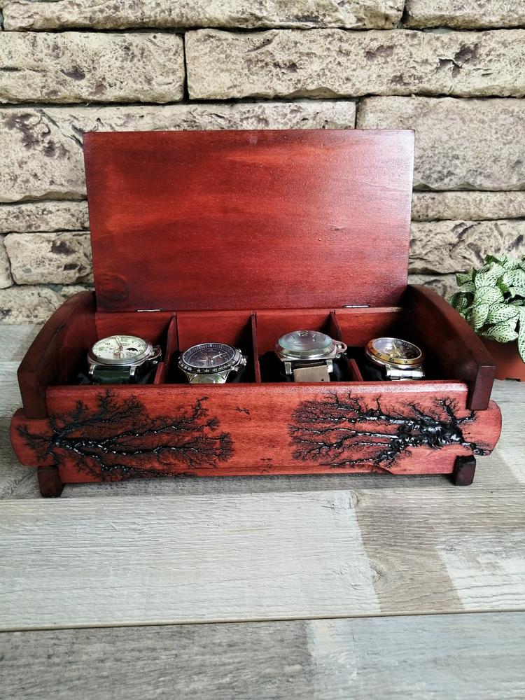 a wooden box with several watches