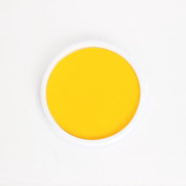 a yellow liquid in a white circle