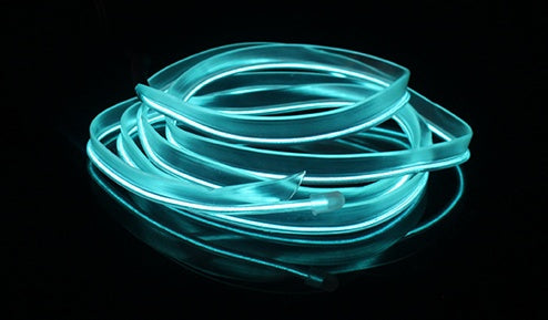 a blue glowing tube on a black surface