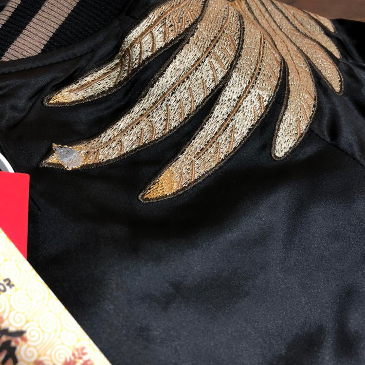 a black jacket with gold embroidery