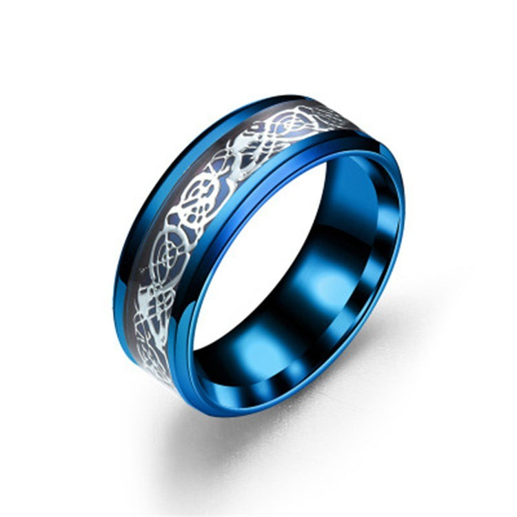 a blue ring with silver design