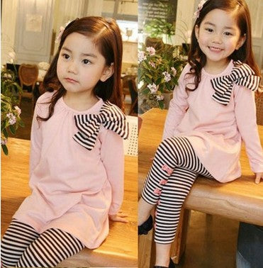 a girl sitting on a table