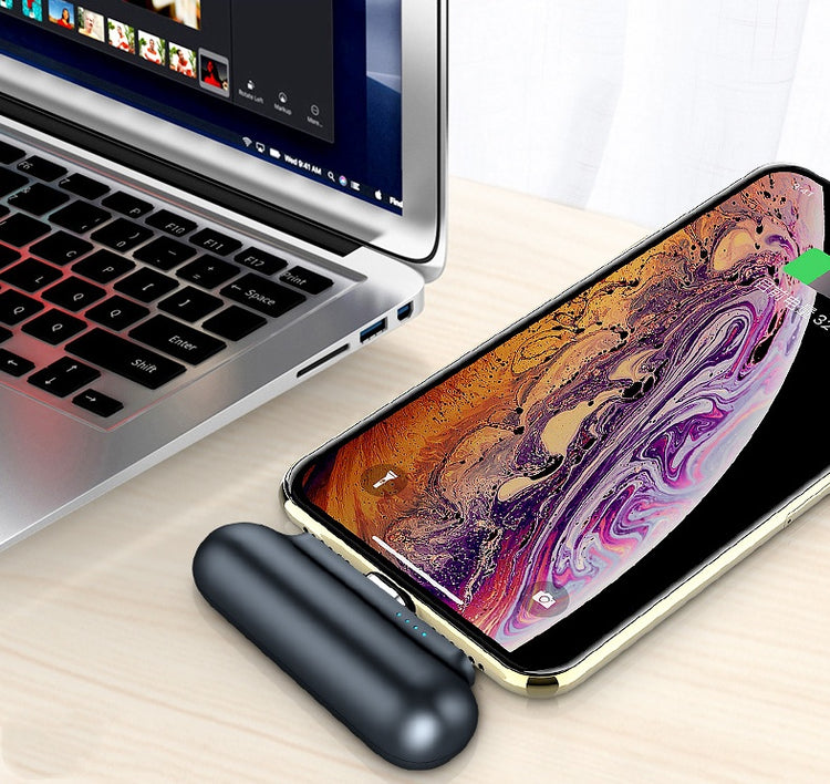 a cell phone on a laptop