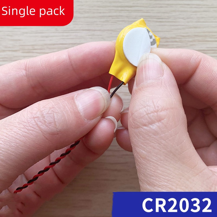 a person holding a small yellow object
