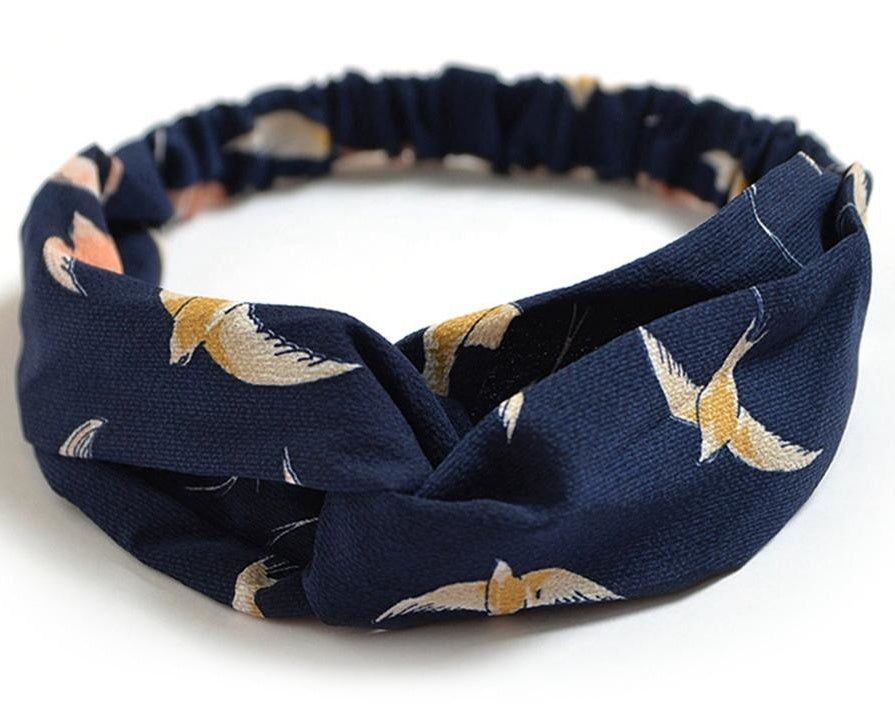 a blue headband with birds on it