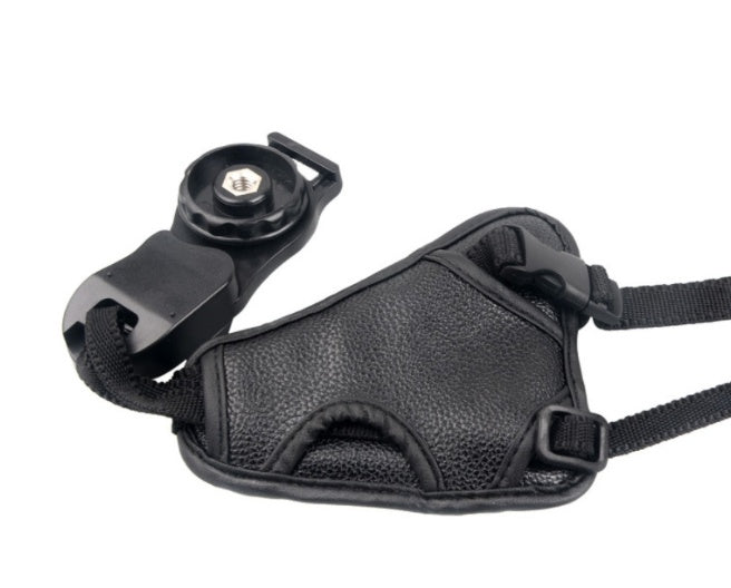 a black strap with a screw on it