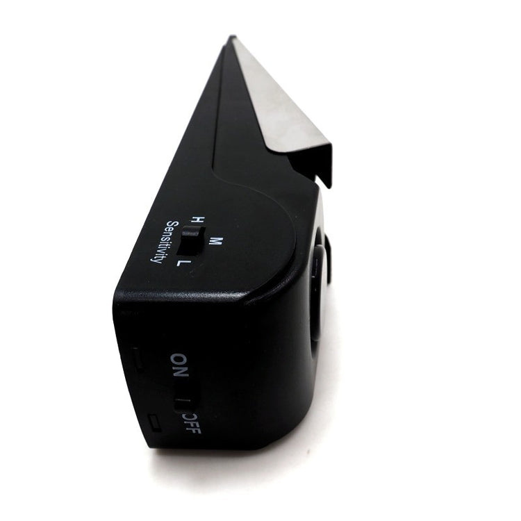 a black device with a metal handle