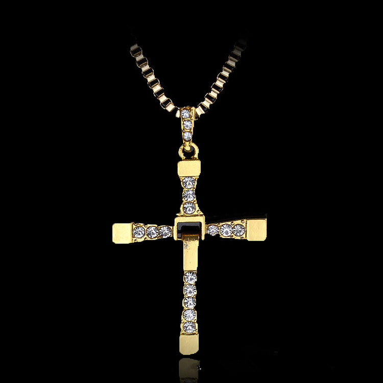 a gold cross necklace with diamonds