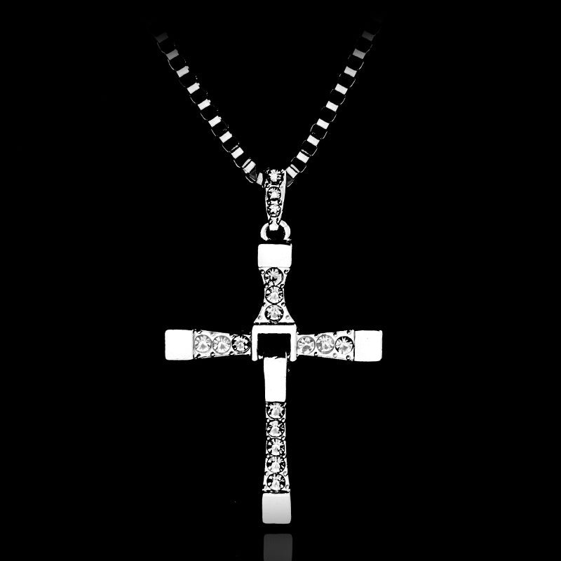 a silver cross necklace with diamonds