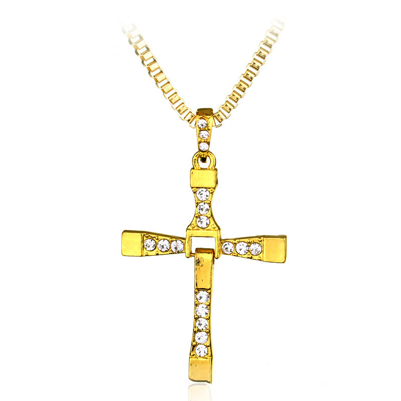 a gold cross necklace with diamonds