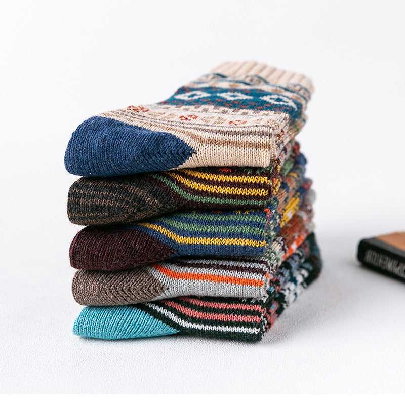 a stack of socks on a white surface