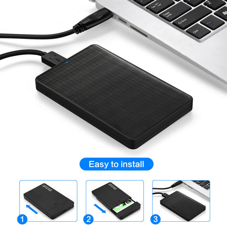 a black rectangular device with a black cord connected to a silver laptop