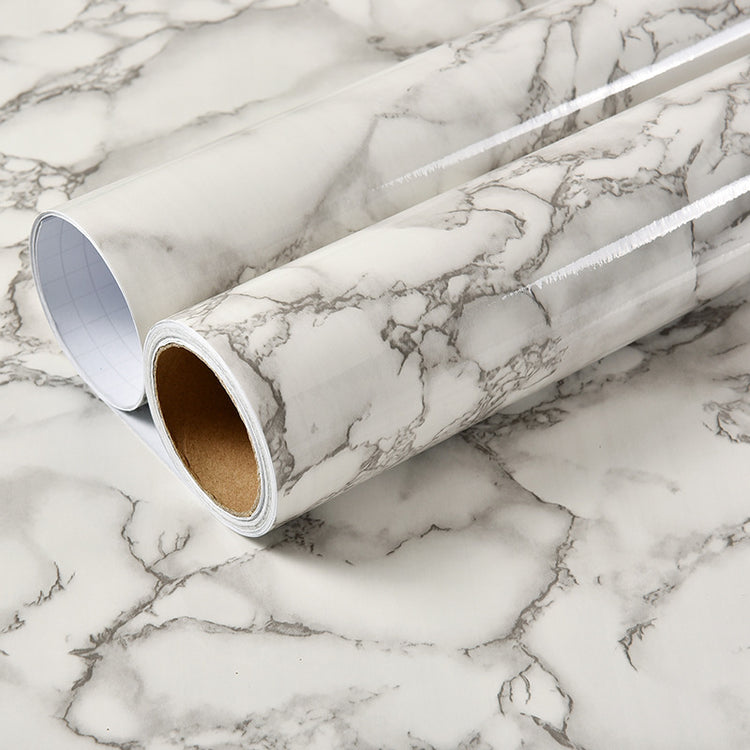 a roll of white and black marbled paper