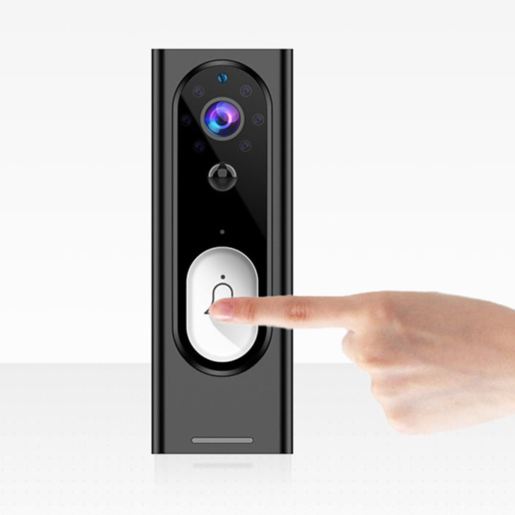 a finger pointing at a black device