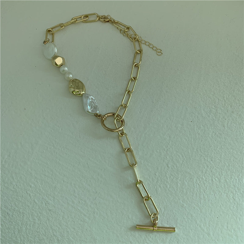 a gold chain with a toggle clasp