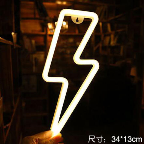 a hand holding a light up sign