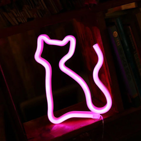 a pink neon cat shaped sign