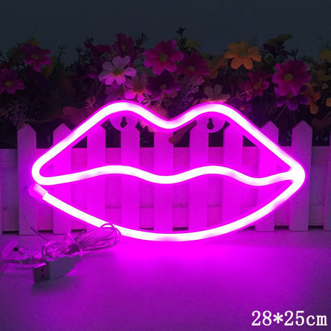 a pink neon lips sign