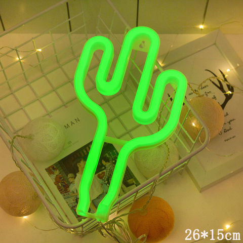 a green neon cactus in a basket