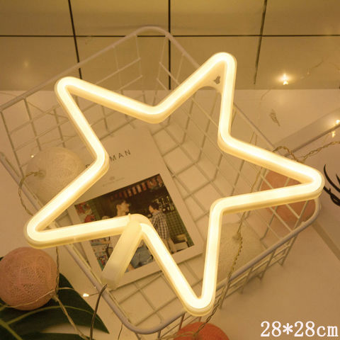 a star shaped light in a shopping cart