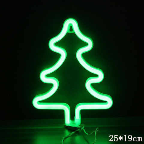 a green neon tree shaped sign