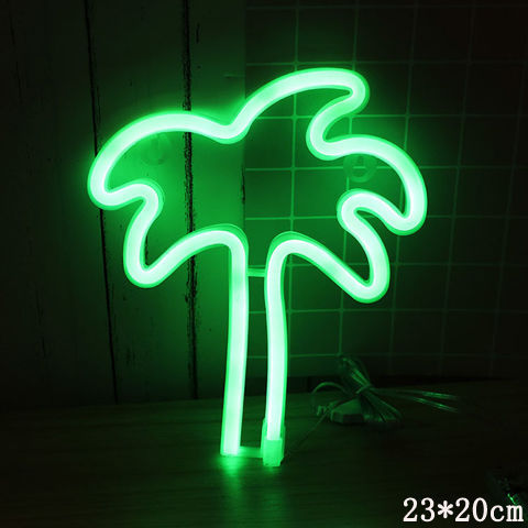 a neon palm tree on a table