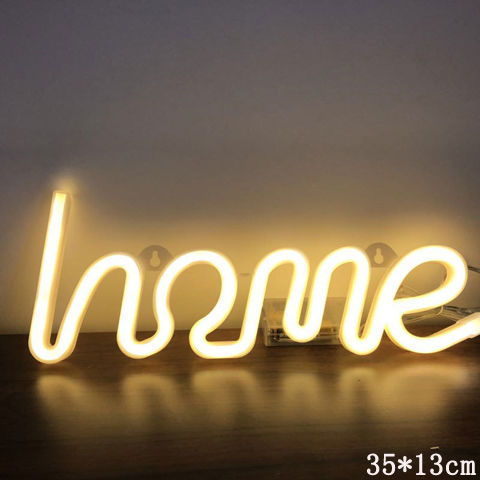 a lit up sign on a table