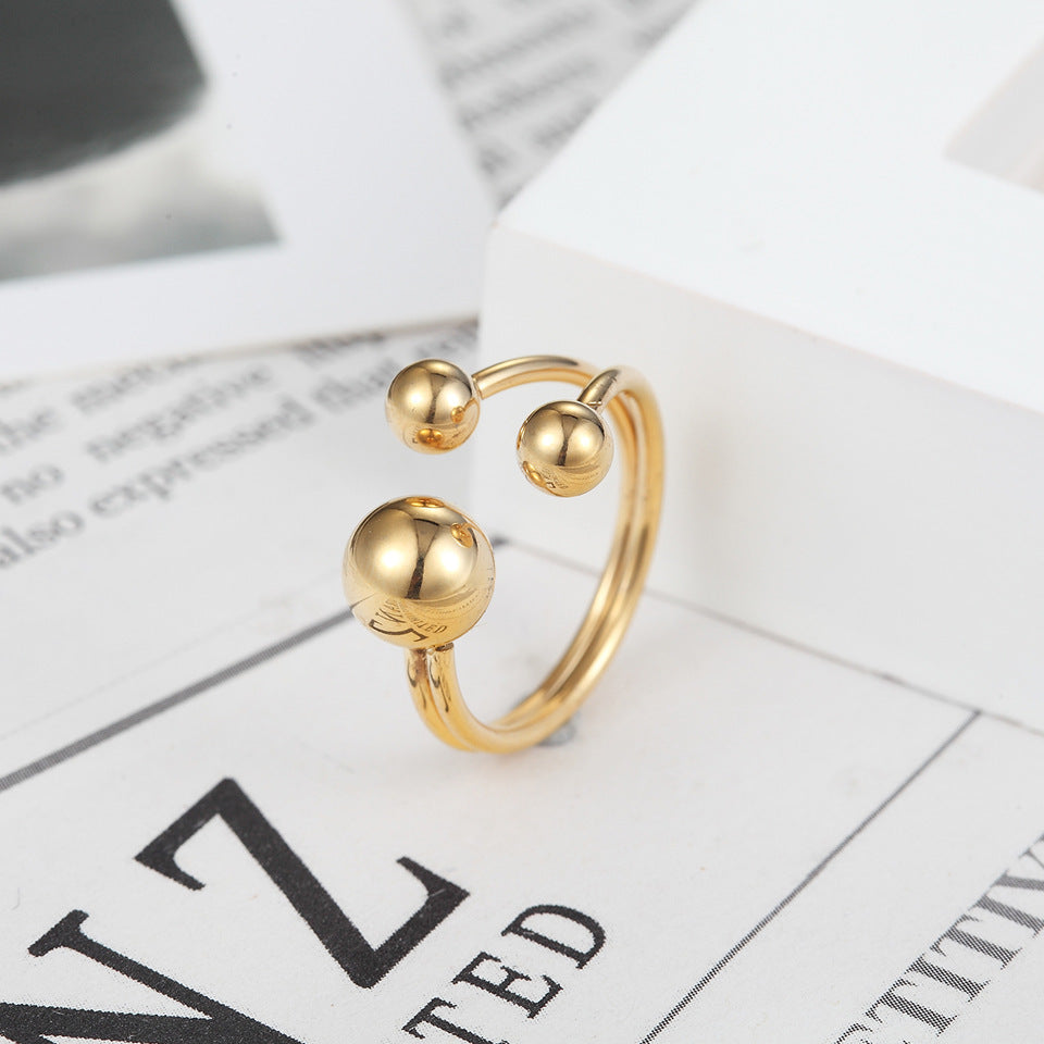a gold ring on a white box