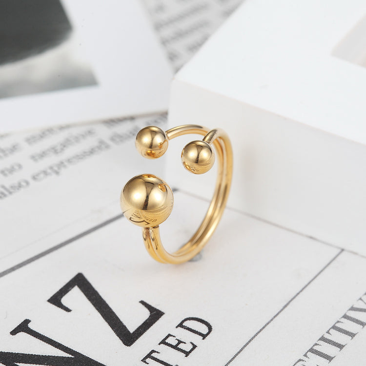 a gold ring on a white box