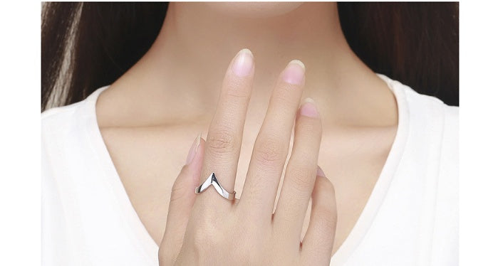 a woman wearing a silver ring