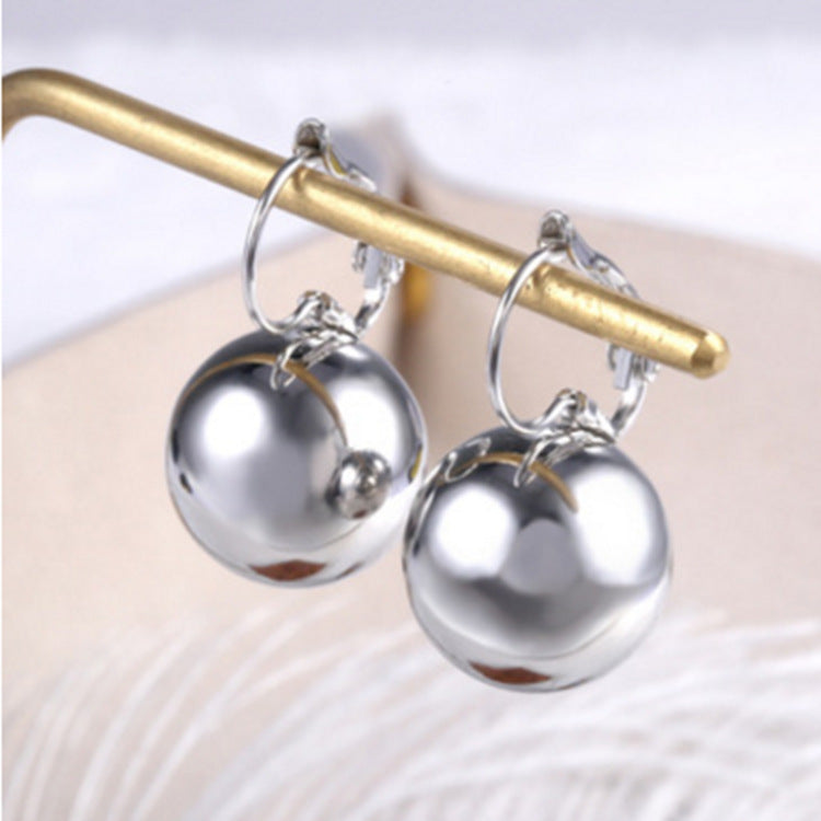 a pair of silver earrings