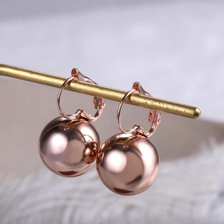 a pair of gold earrings