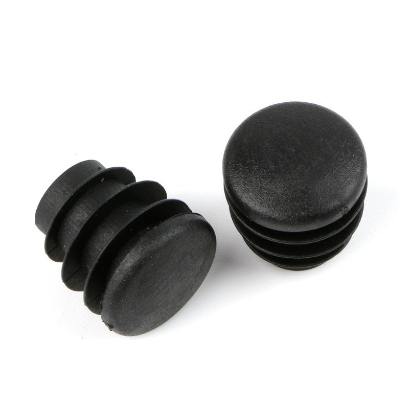 a close-up of a pair of black plugs