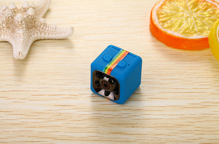 a blue cube with a camera on a table
